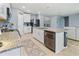 Open kitchen with granite countertops, stainless steel appliances, and island with seating at 460 Sarah Nicole Way, New Smyrna Beach, FL 32168