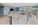 Open concept kitchen with granite countertops, stainless steel sink and ample counter space at 460 Sarah Nicole Way, New Smyrna Beach, FL 32168