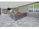 Cozy screened patio with comfortable seating area and a view of the backyard at 460 Sarah Nicole Way, New Smyrna Beach, FL 32168