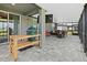 Outdoor kitchen on screened lanai featuring a grill and an entertainment area at 460 Sarah Nicole Way, New Smyrna Beach, FL 32168