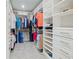 Spacious walk-in closet with custom shelving and ample storage space for clothes and accessories at 460 Sarah Nicole Way, New Smyrna Beach, FL 32168
