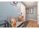 Welcoming entryway with a bench, colorful cushions, attractive artwork, and wood-look flooring at 5 Greenfern Cir, Ormond Beach, FL 32174