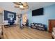 Stylish living room with a TV, an exercise bike, comfortable seating and laminate flooring at 5 Greenfern Cir, Ormond Beach, FL 32174