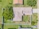Aerial view of a well-maintained home with lush landscaping and a private, fenced backyard at 5478 Landis Ave, Port Orange, FL 32127