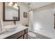 Elegant bathroom with a vessel sink, marble countertop, and a bathtub with tiled shower at 5478 Landis Ave, Port Orange, FL 32127
