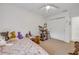 Bedroom with carpet, furniture and a closet with sliding doors and a view to the outside at 5478 Landis Ave, Port Orange, FL 32127