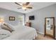 Neutral bedroom with carpet, TV on the wall, mirror on the floor, and a view to the porch at 5478 Landis Ave, Port Orange, FL 32127