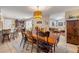 Open dining area with view into the living room and kitchen, featuring unique decor and lighting at 5478 Landis Ave, Port Orange, FL 32127