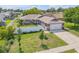 Lovely home showcasing a well-kept lawn, a two car garage, and a white fence at 5478 Landis Ave, Port Orange, FL 32127