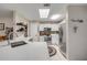 Bright kitchen with white cabinets, stone backsplash, stainless steel appliances, and a skylight at 5478 Landis Ave, Port Orange, FL 32127