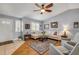 Bright living room with vaulted ceiling, ceiling fan, and comfortable seating at 5478 Landis Ave, Port Orange, FL 32127