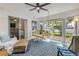 Bright living room with a hanging swing chair and glass doors leading to the outdoor patio at 5478 Landis Ave, Port Orange, FL 32127