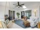 Bright porch with a swing, comfortable armchair, and views to the inside and outside of the house at 5478 Landis Ave, Port Orange, FL 32127