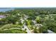 Aerial view of a charming home in a lush, green neighborhood with proximity to the waterfront at 556 N Beach St, Ormond Beach, FL 32174