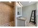 Updated bathroom featuring a tiled walk-in shower and modern vanity at 556 N Beach St, Ormond Beach, FL 32174