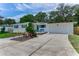 Charming single-story home with blue shutters and a well-manicured front yard at 556 N Beach St, Ormond Beach, FL 32174