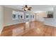Bright, open living room with hardwood floors, connecting to dining and sunroom spaces at 556 N Beach St, Ormond Beach, FL 32174