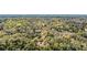 Aerial view of the property nestled within a densely wooded landscape at 5721 John Anderson Hwy, Flagler Beach, FL 32136