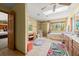 Well-lit bathroom with a large soaking tub, separate shower, and tiled floors, providing a spa-like experience at 5721 John Anderson Hwy, Flagler Beach, FL 32136