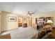 Spacious bedroom featuring a ceiling fan, carpet floors and built in desk area at 5721 John Anderson Hwy, Flagler Beach, FL 32136