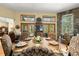 Well-appointed dining room with views and ample natural light, perfect for hosting elegant gatherings at 5721 John Anderson Hwy, Flagler Beach, FL 32136