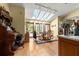 Sunlit dining room with skylights, a dining table, and hardwood floors at 5721 John Anderson Hwy, Flagler Beach, FL 32136
