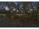 Inviting exterior with mature landscaping and a stone entryway at 5721 John Anderson Hwy, Flagler Beach, FL 32136