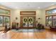 Open foyer with hardwood floors, complemented by a unique stone accent wall and views of the landscaped yard at 5721 John Anderson Hwy, Flagler Beach, FL 32136