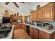 Traditional kitchen featuring wooden cabinets, countertops, and modern appliances at 5721 John Anderson Hwy, Flagler Beach, FL 32136