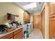 Well-equipped laundry room with built-in cabinets, a sink, and laundry appliances at 5721 John Anderson Hwy, Flagler Beach, FL 32136