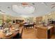 Open living space featuring hardwood floors, a pool table, and access to a wet bar, ideal for entertaining at 5721 John Anderson Hwy, Flagler Beach, FL 32136