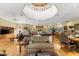 Bright living area with hardwood floors, custom built-ins, and an adjacent billiard room for added entertainment at 5721 John Anderson Hwy, Flagler Beach, FL 32136