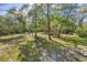 Expansive grassy yard with mature trees providing ample shade at 5721 John Anderson Hwy, Flagler Beach, FL 32136