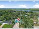 Aerial view of the home showcasing its location near the water and lush surroundings at 61 E Bayshore Dr, Port Orange, FL 32127