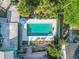 Aerial view of pool area with patio furniture and well maintained property at 61 E Bayshore Dr, Port Orange, FL 32127