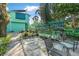 Serene backyard with patio seating and decorative plants, perfect for relaxation at 61 E Bayshore Dr, Port Orange, FL 32127