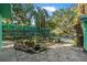 Tranquil backyard with lush landscaping and brick patio area for relaxation at 61 E Bayshore Dr, Port Orange, FL 32127