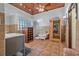 Bathroom with wood ceilings, tile floors, glass block window, sauna, tub, and walk-in shower at 61 E Bayshore Dr, Port Orange, FL 32127