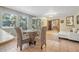 Dining area with tile flooring, modern table set, open to the living room and kitchen at 61 E Bayshore Dr, Port Orange, FL 32127