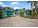 Charming single-Gathering home featuring a colorful exterior, spacious driveway, and well-maintained landscaping at 61 E Bayshore Dr, Port Orange, FL 32127