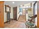 Open foyer with tiled staircase, decorative mirror, and detailed architectural accents at 61 E Bayshore Dr, Port Orange, FL 32127