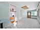 Bright hallway with tiled floors, natural light, and an exterior door at 61 E Bayshore Dr, Port Orange, FL 32127