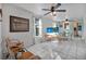 Open living room with tiled floors, ceiling fans, and comfortable seating at 61 E Bayshore Dr, Port Orange, FL 32127