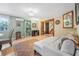 Relaxing space with a comfortable seating area, stylish bookcase, and easy access to adjacent rooms at 61 E Bayshore Dr, Port Orange, FL 32127