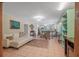 Open-concept living and dining area with tile floors, bright light, and stylish furnishings at 61 E Bayshore Dr, Port Orange, FL 32127