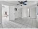 Spacious, tiled living room with doorways and access to other rooms at 61 E Bayshore Dr, Port Orange, FL 32127