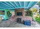 Outdoor kitchen with brick oven, perfect for outdoor cooking and entertaining at 61 E Bayshore Dr, Port Orange, FL 32127