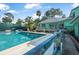 Inviting pool area with lounge chairs and well-maintained deck offers a relaxing outdoor retreat at 61 E Bayshore Dr, Port Orange, FL 32127