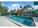 Gorgeous pool with ample space and privacy, complemented by verdant surroundings at 61 E Bayshore Dr, Port Orange, FL 32127