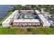 Aerial view of condos featuring a central pool and ample parking at 625 N Halifax Ave # 11, Daytona Beach, FL 32118